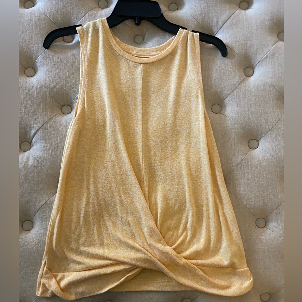 A New Day tank with knot